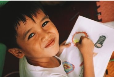 Child drawing on paper
